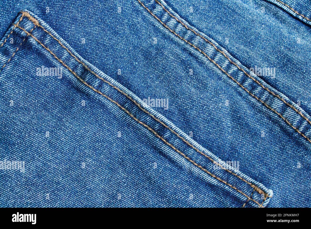 Blue jeans close up. Light blue thick fabric for trousers. Stock Photo