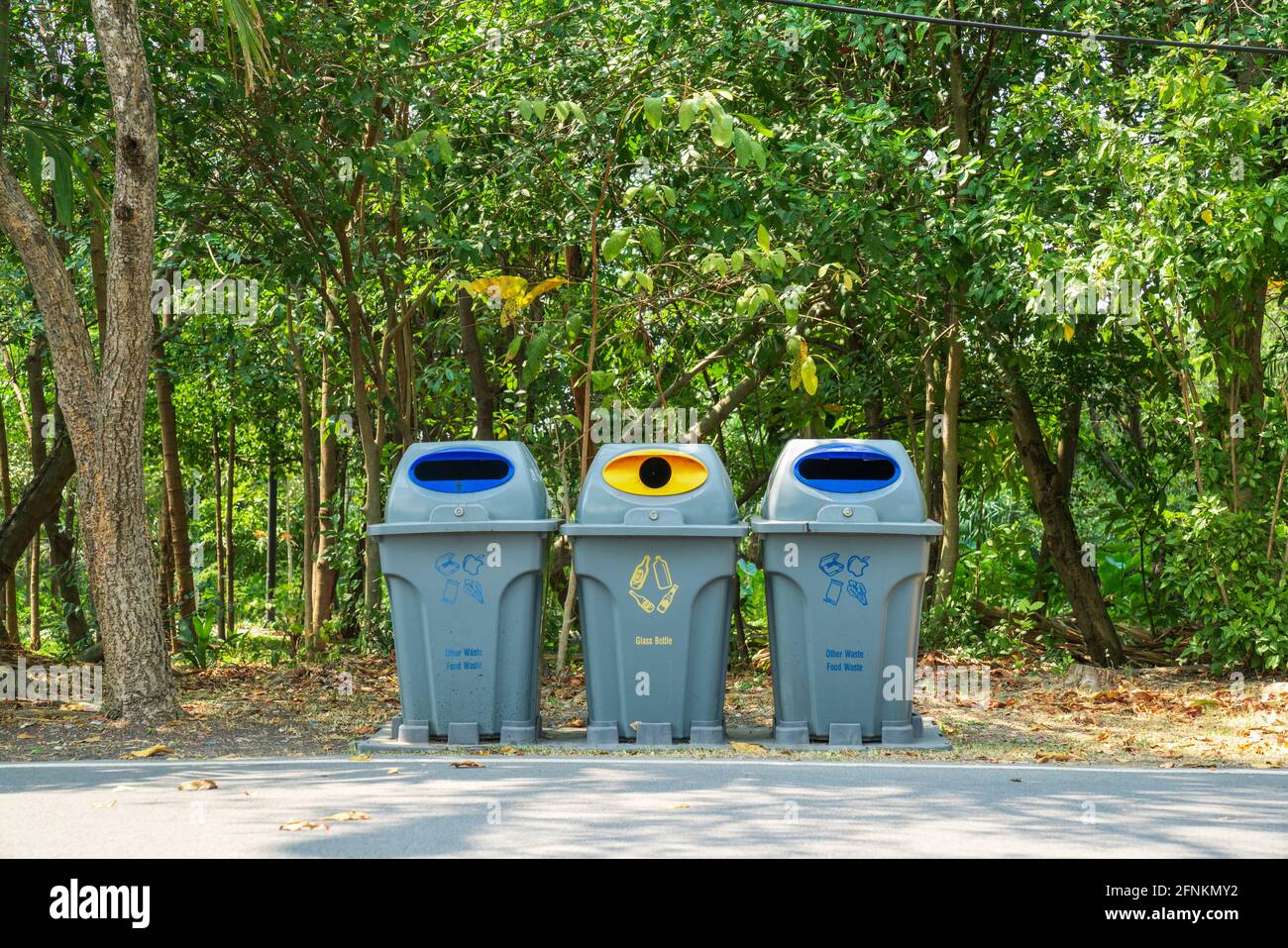 Three recycling bins in the public park Stock Photo Alamy