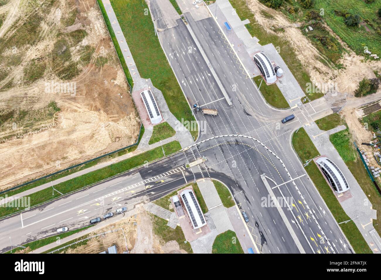 suburb crossroad under construction. road construction site. aerial view Stock Photo