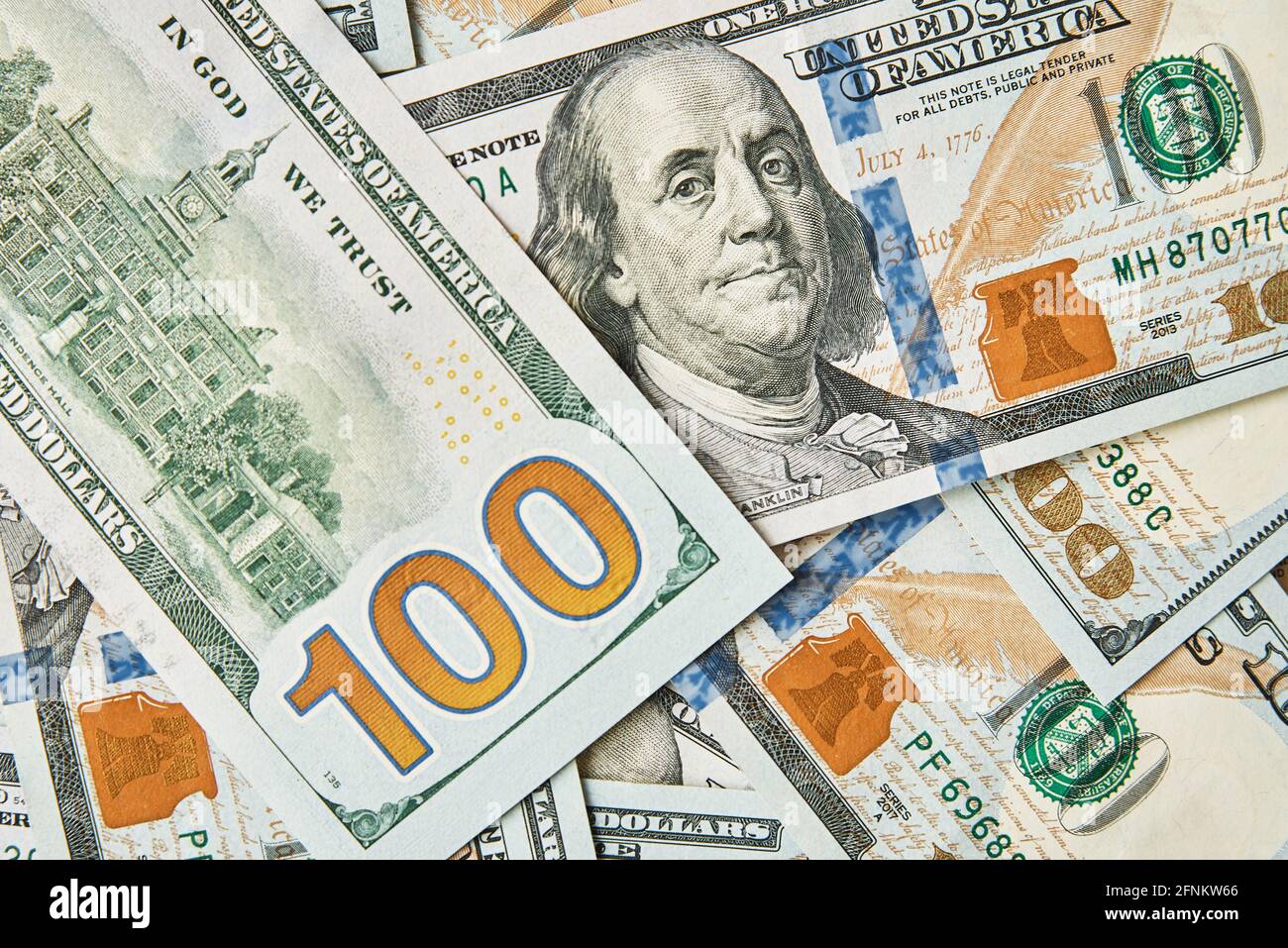 Dollar bills background. Pile of american money cash. One hundred usd dollars banknotes. Stock Photo