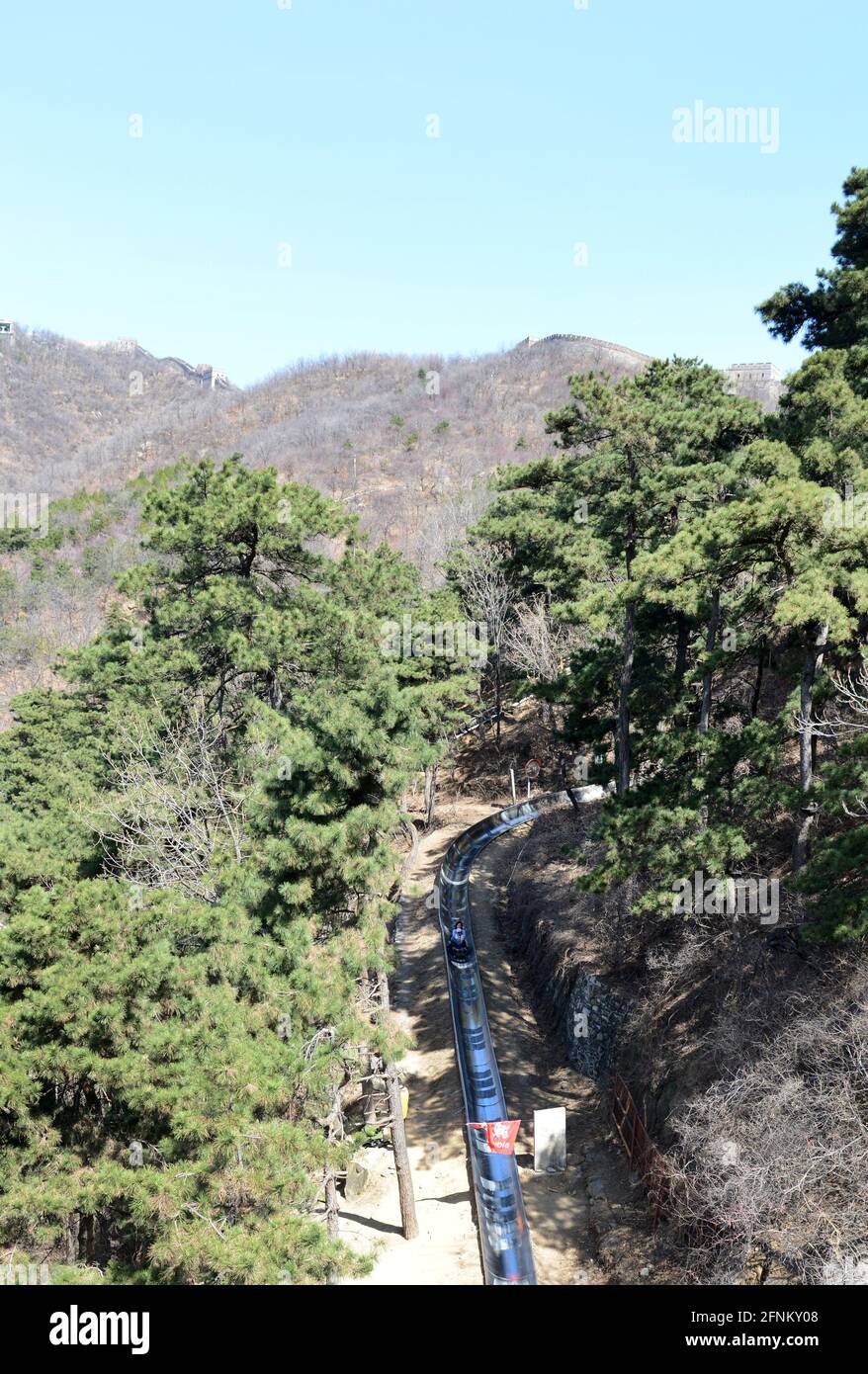 toboggan sliding down from the great wall in Mutianyu, China Stock