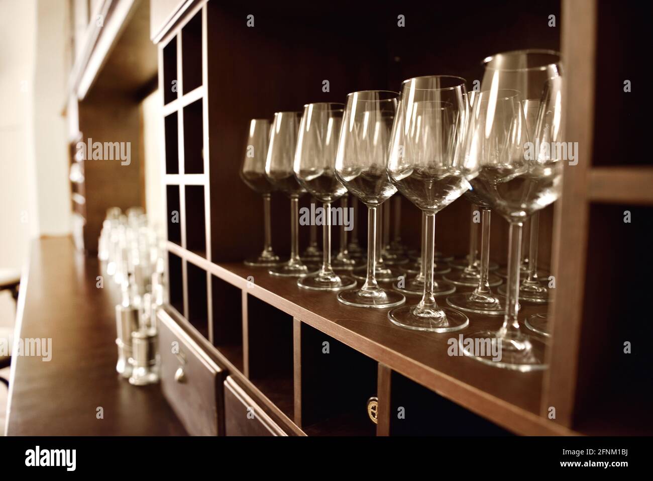 Empty wine glasses in row. Shallow depth of field. Focus on foreground Stock Photo