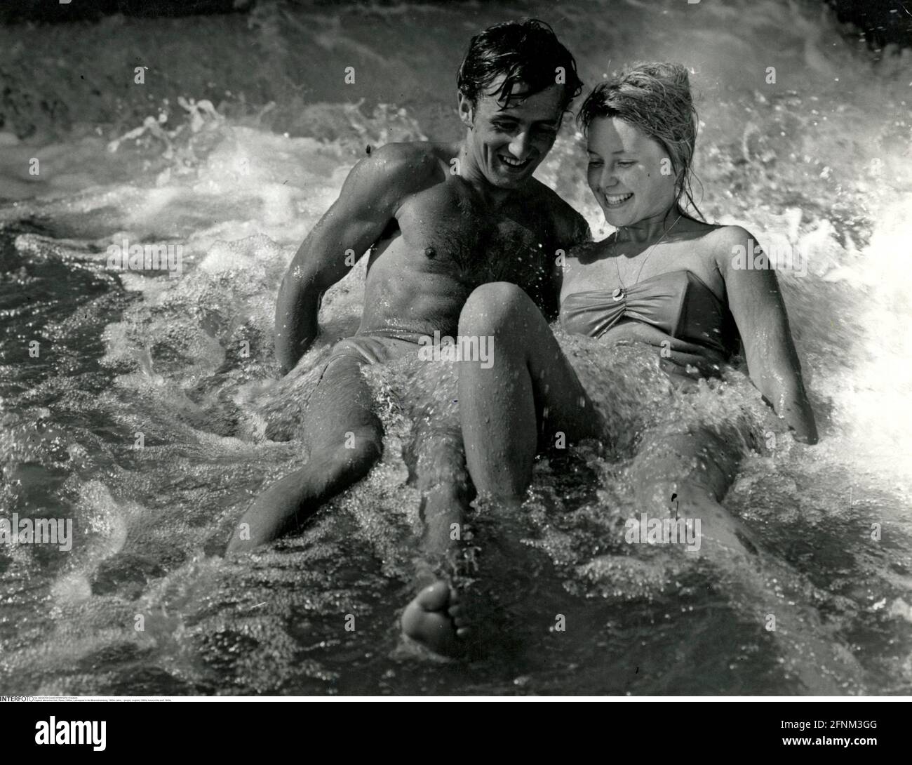 people, couples, 1960s, lovers in the surf, 1960s, ADDITIONAL-RIGHTS-CLEARANCE-INFO-NOT-AVAILABLE Stock Photo