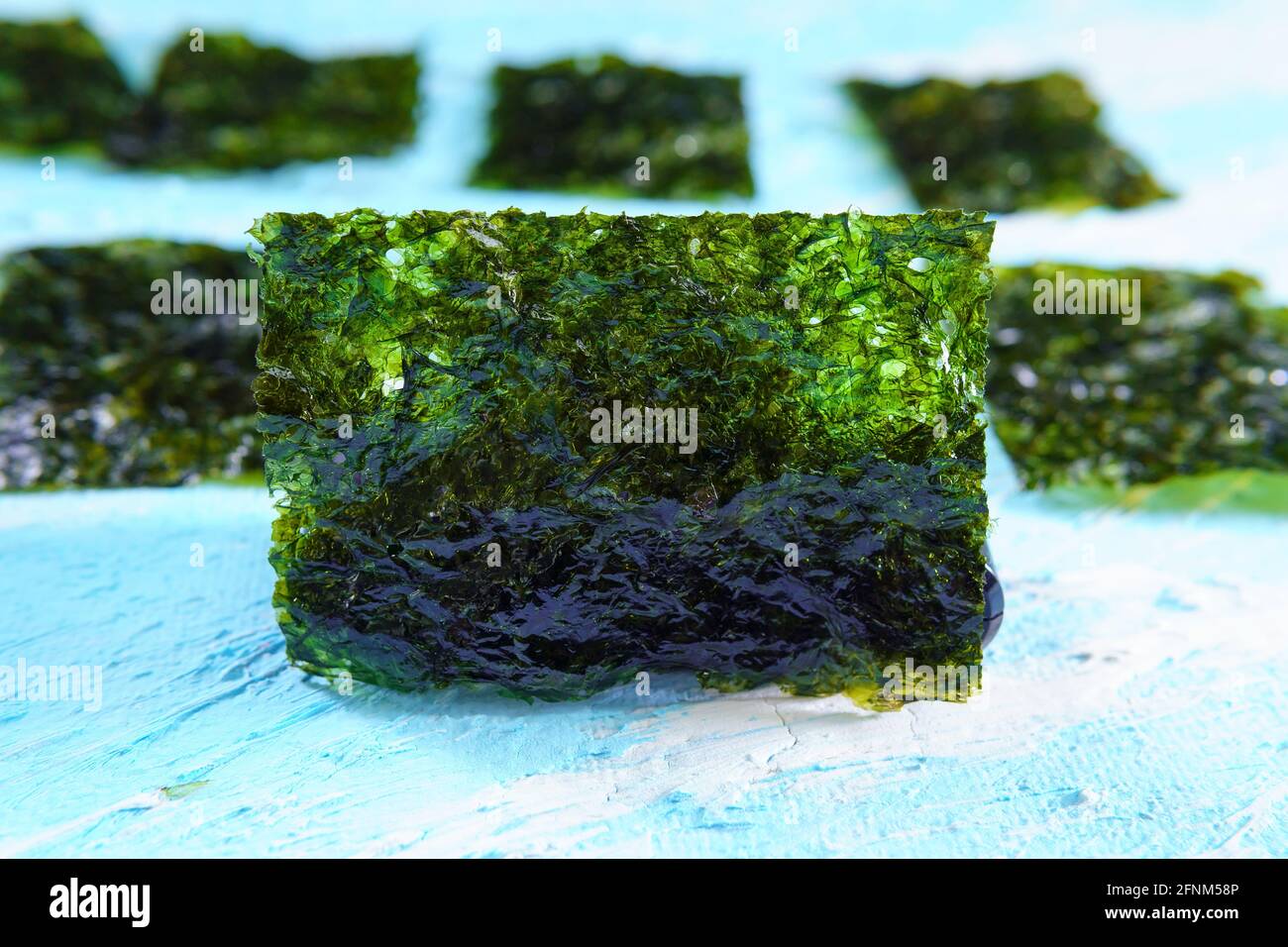 Crispy dried seaweed close up, Nori chips piece of roasted seaweed
