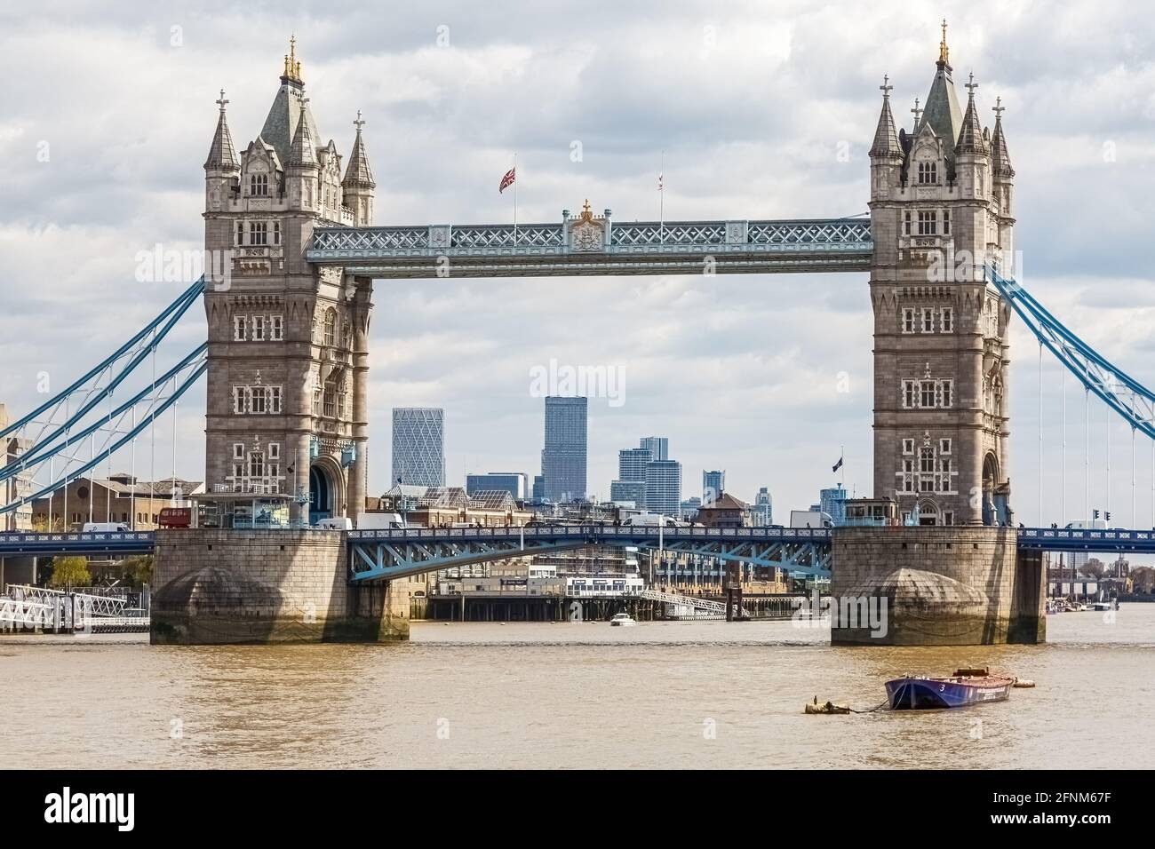 A view of the  London Skyline framed by the North and South towers of Tower Bridge, a juxtaposition of London's old and new architecture. Stock Photo