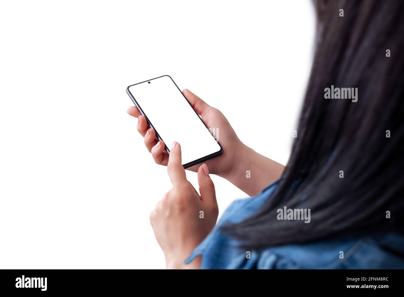 Woman holding smart phone and touch display concept. View over the shoulder. Isolated background and phone screen Stock Photo