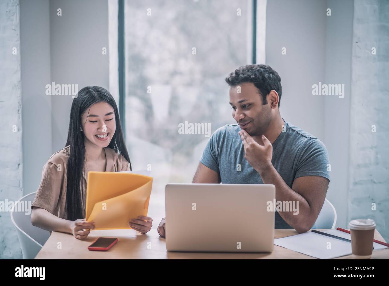 A chief and his assistant working in the office Stock Photo - Alamy