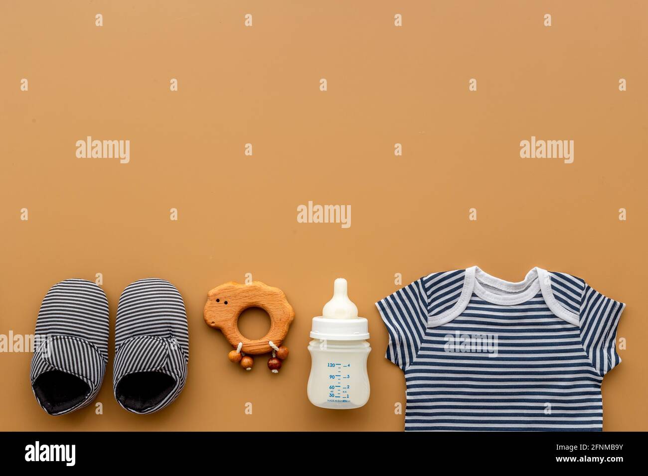 Set of baby boy accessories with milk bottle Stock Photo Alamy