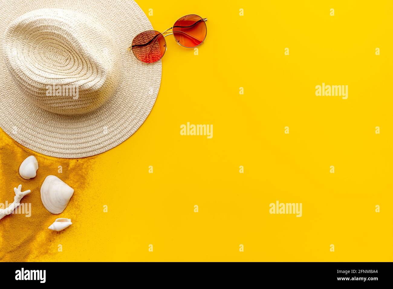 Straw beach womans hat with sun glasses on sand. Top view Stock Photo ...