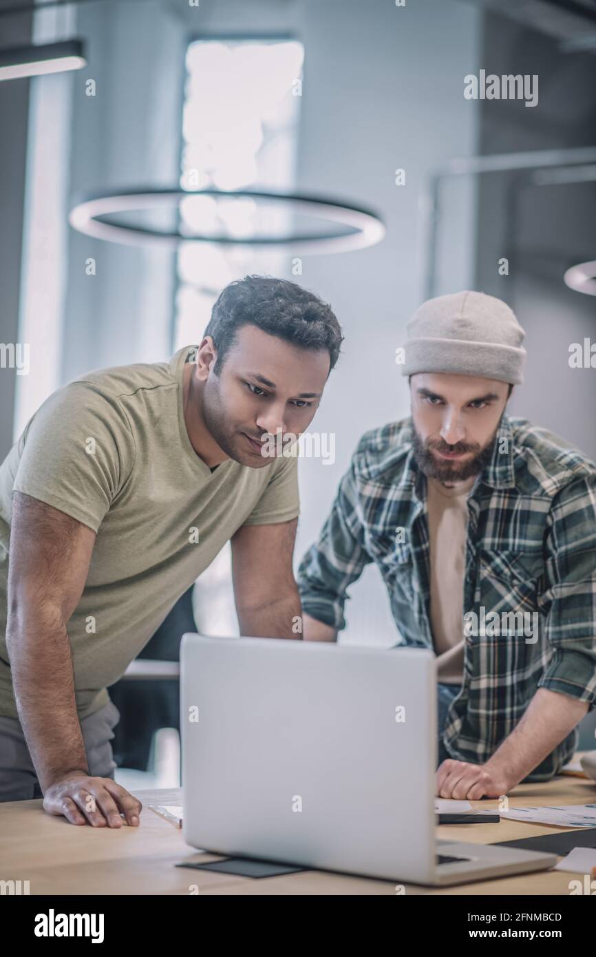 Young colleagues working together planning hi-res stock photography and ...