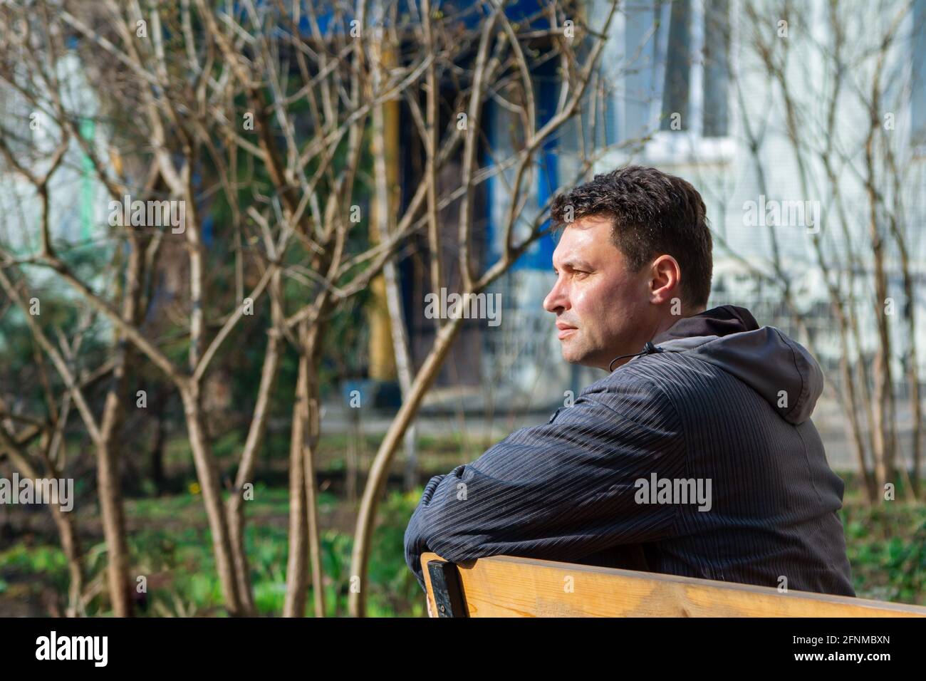 Sad man sitting on bench hi-res stock photography and images - Alamy