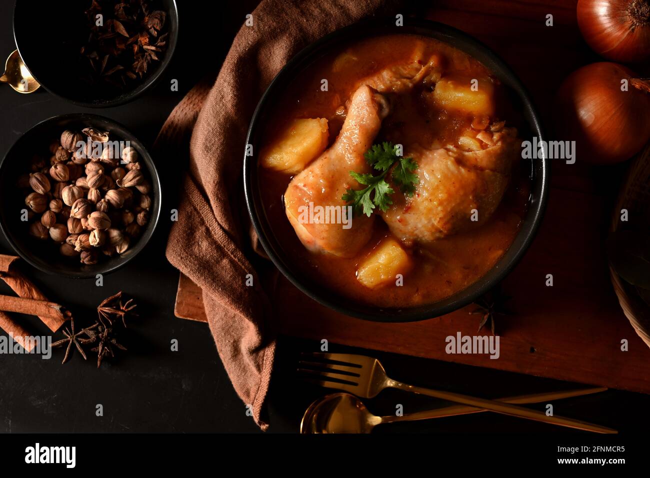 Top view of Thai traditional food, chicken Massaman Curry soup with ingredients on the table Stock Photo