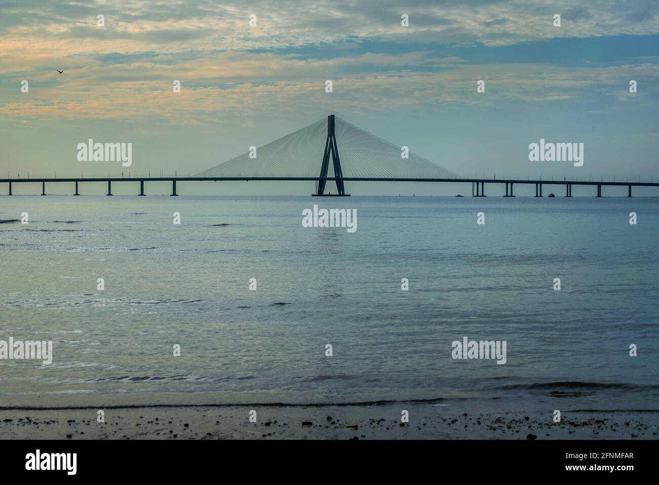 The Bandra–Worli Sea Link, also called Rajiv Gandhi Sea Link, clicked on a bright cloudy day just before sunset Stock Photo