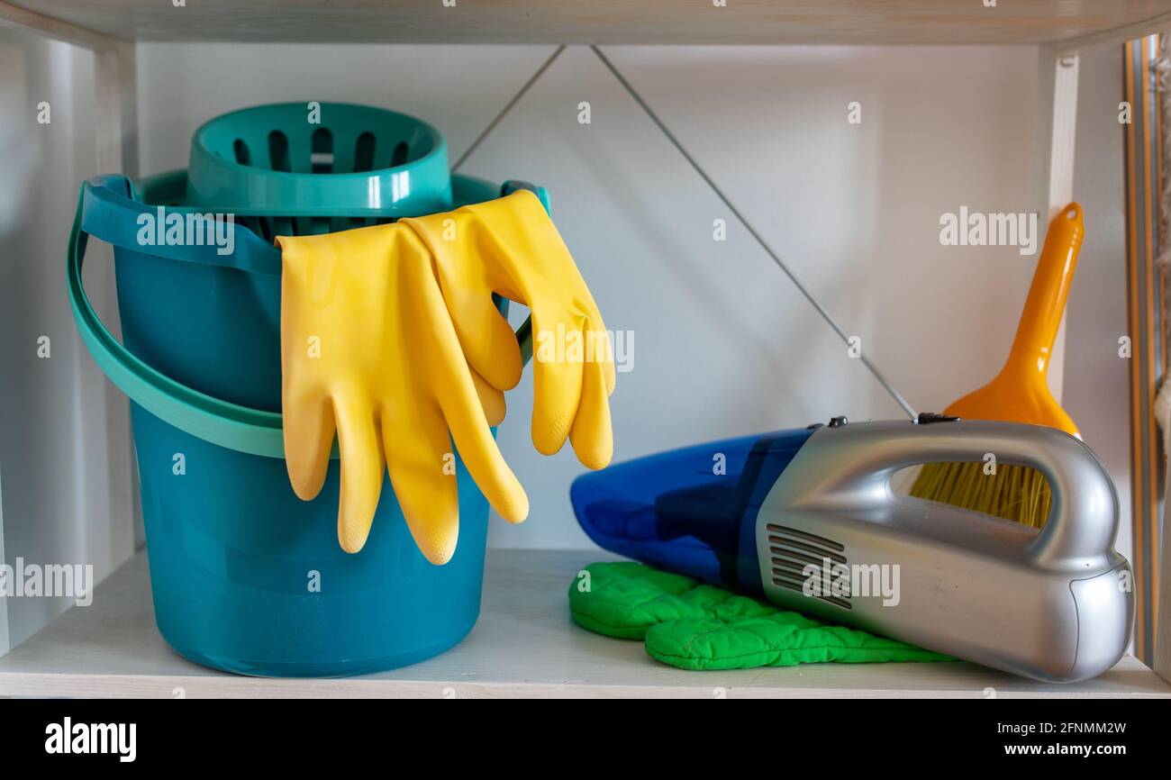 Cleaning supplies and tools on shelves and cabinets in pantry room Stock  Photo - Alamy