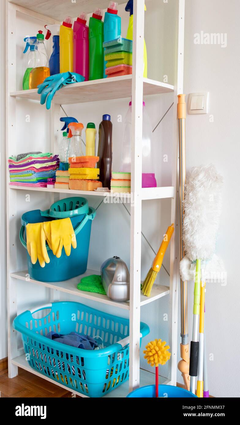 Shelves with cleaning products and tools in pantry Stock Photo Alamy