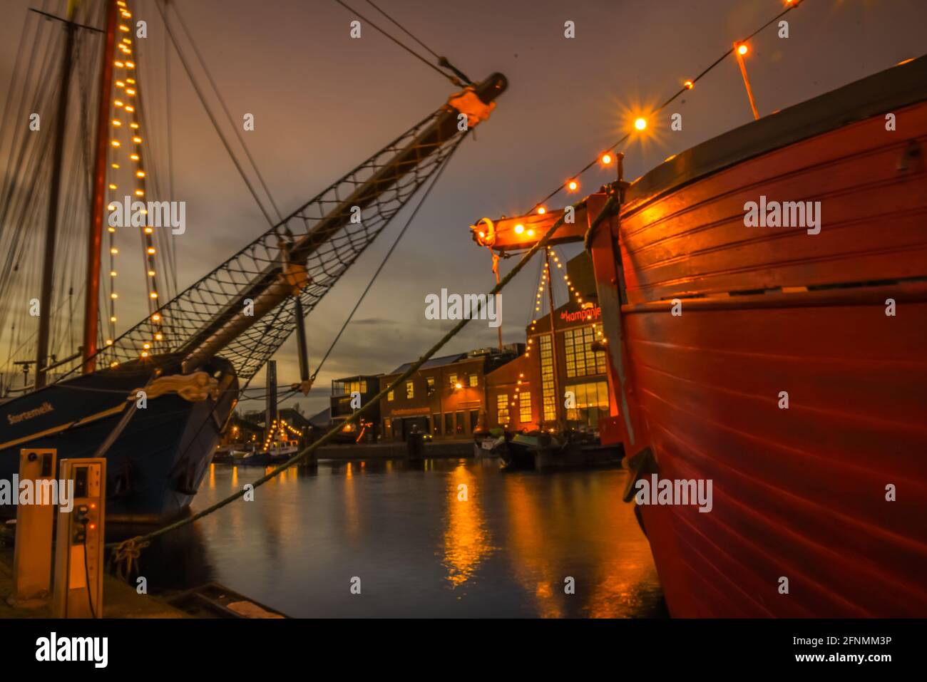 Den Helder, The Netherlands - December 18, 2020. The harbour of Den helder near trhe old shipyard 'Willemsoord', at dusk. Stock Photo
