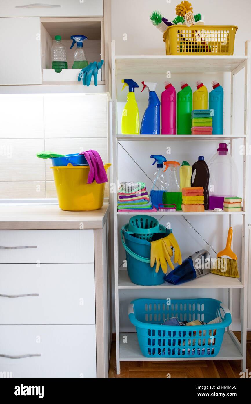 https://c8.alamy.com/comp/2FNMM6C/cleaning-supplies-and-tools-on-shelves-and-cabinets-in-pantry-room-2FNMM6C.jpg