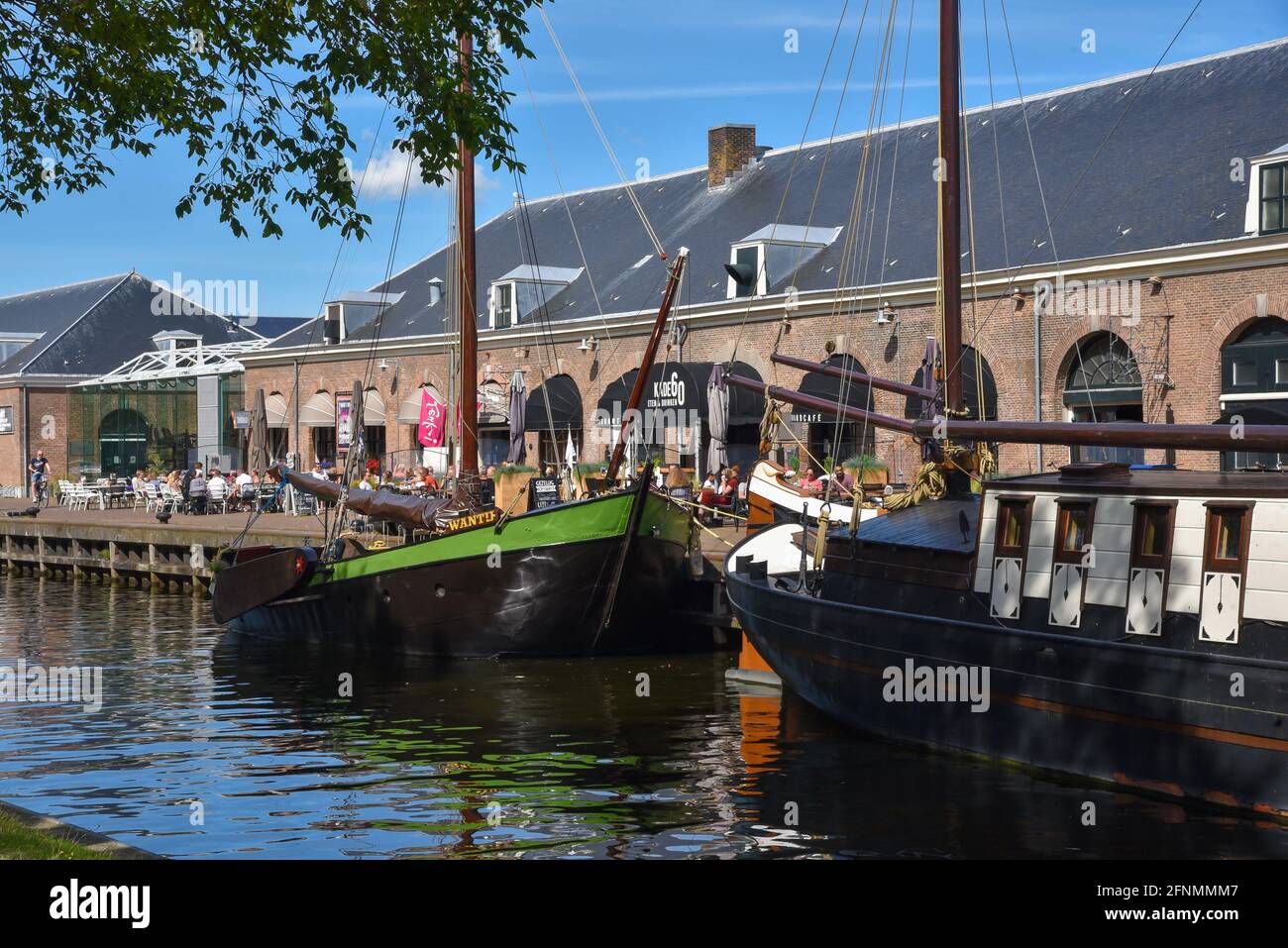 Den Helder, the Netherlands. The boats and warehouses of the former shipyard Willems in Den Helder, the Netherlands. High quality photo. Industrial heritage. Stock Photo