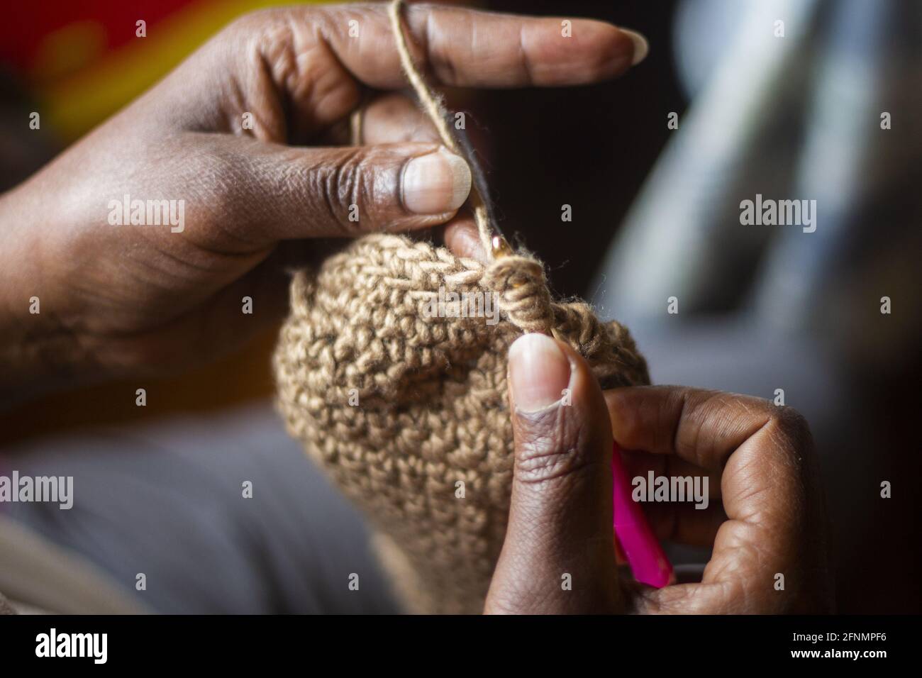 Close up of a woman's hand crocheting Stock Photo