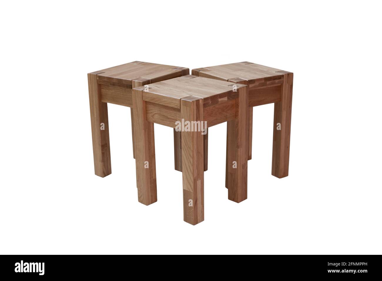 A set of three oak chairs. Kitchen chairs made of wood. Stock Photo