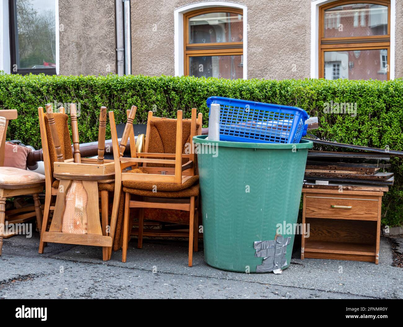 Clearing out bulky waste on the roadside Stock Photo
