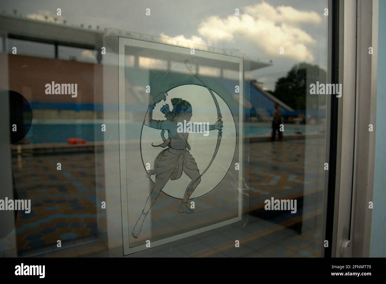 Logo of Senayan Sports Complex (Gelora Bung Karno) on a glass door at aquatic sports center in Senayan Sports Complex (Gelora Bung Karno), Jakarta, Indonesia. Stock Photo