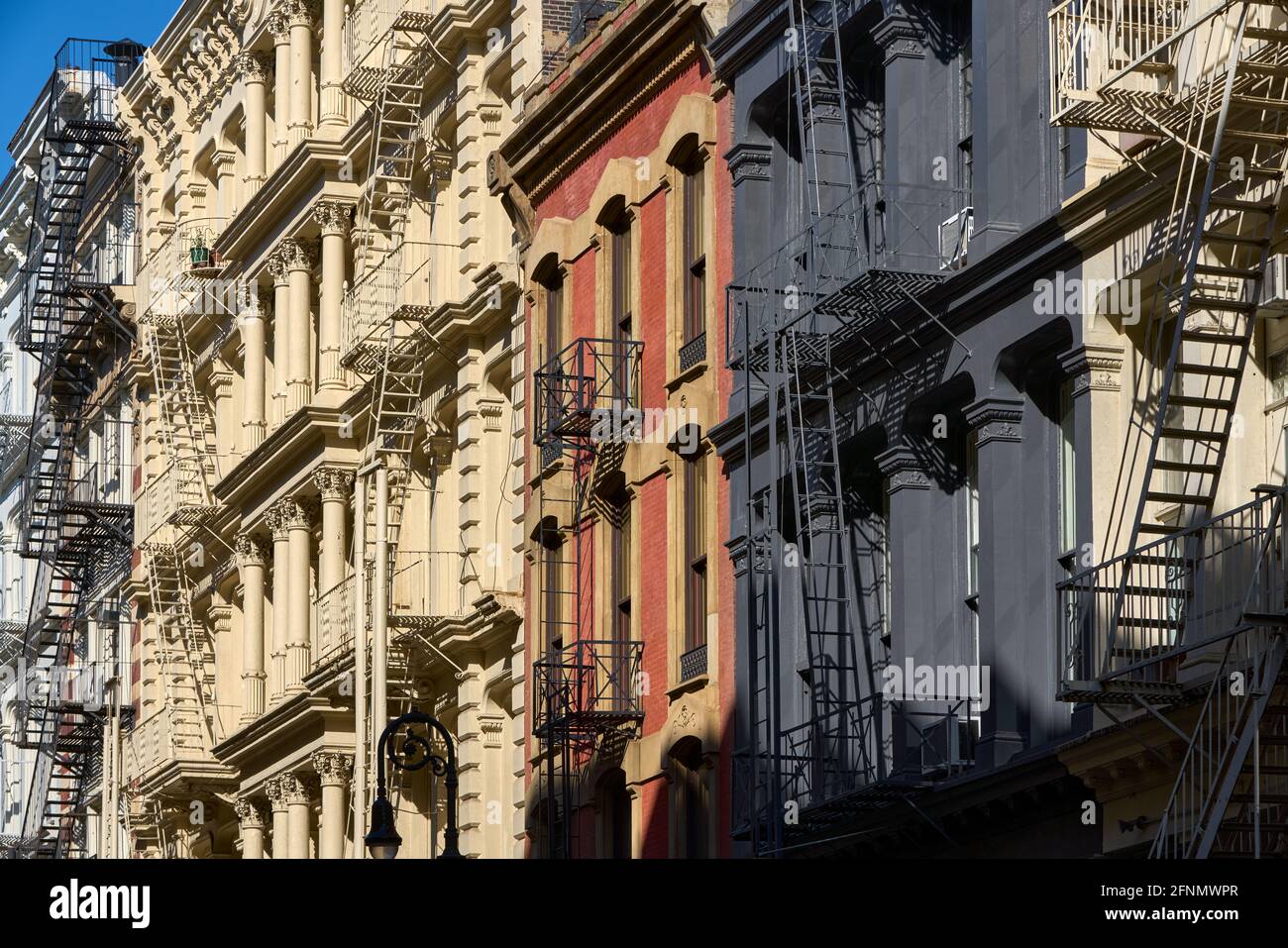 Typical building facades in SoHo, the Cast Iron Historic District with distinct late 19th century architecture. Lower Manhattan, New York City, USA Stock Photo