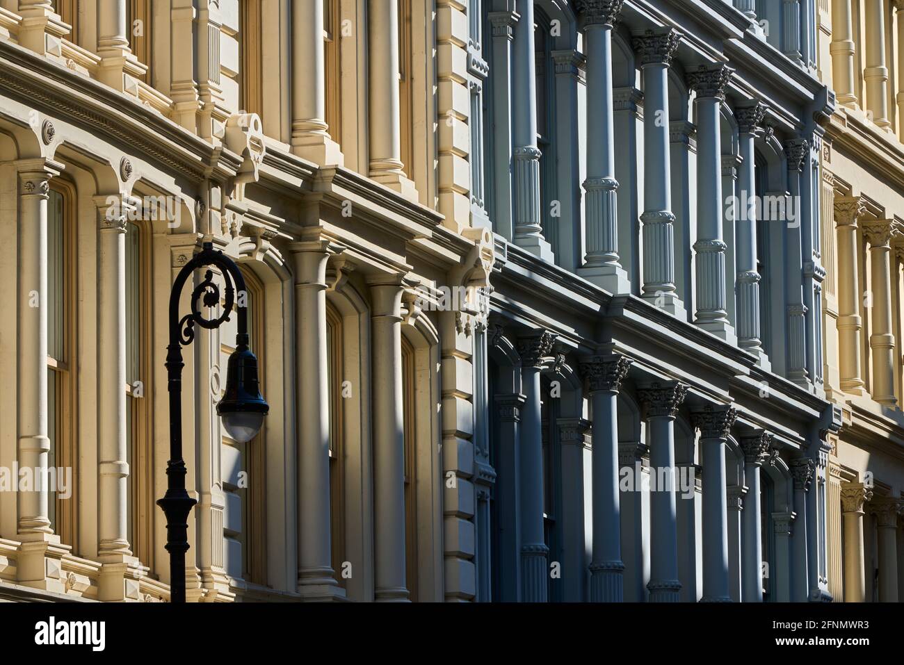 Typical building facades in SoHo, the Cast Iron Historic District with distinct late 19th century architecture. Lower Manhattan, New York City, USA Stock Photo