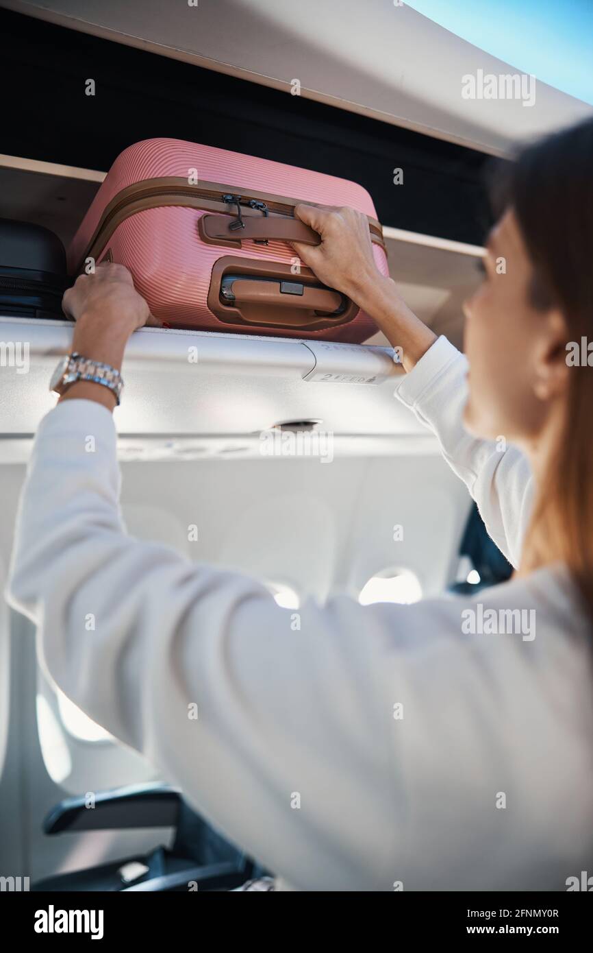 Airplane luggage rack hires stock photography and images Alamy