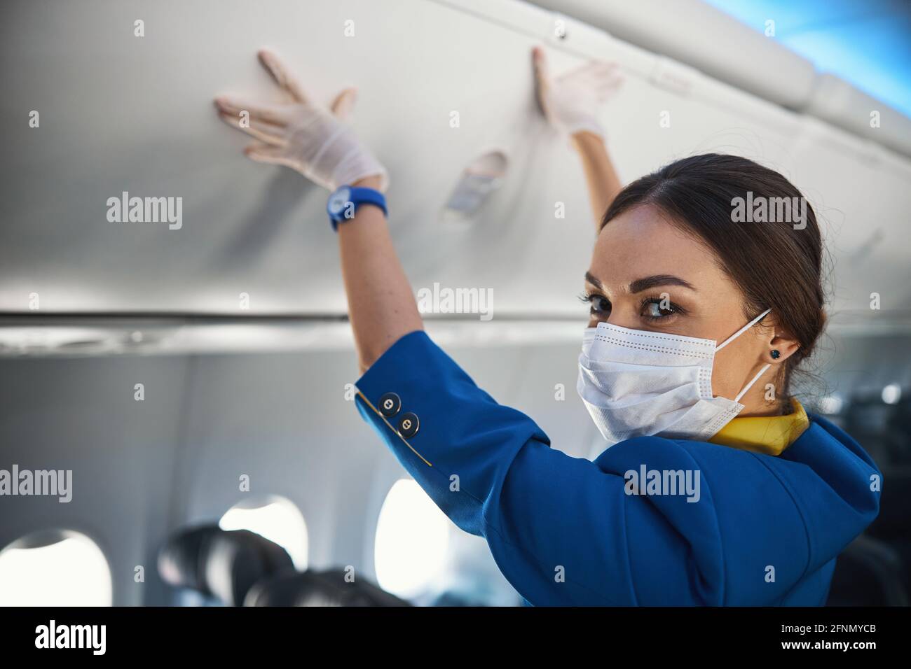 Airplane cabin luggage rack hi-res stock photography and images - Alamy