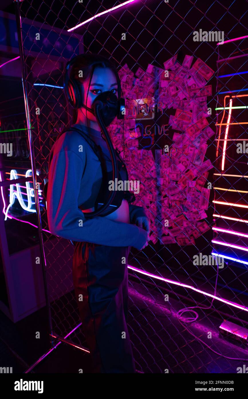 Woman in headphones gas mask hi-res stock photography and images - Alamy