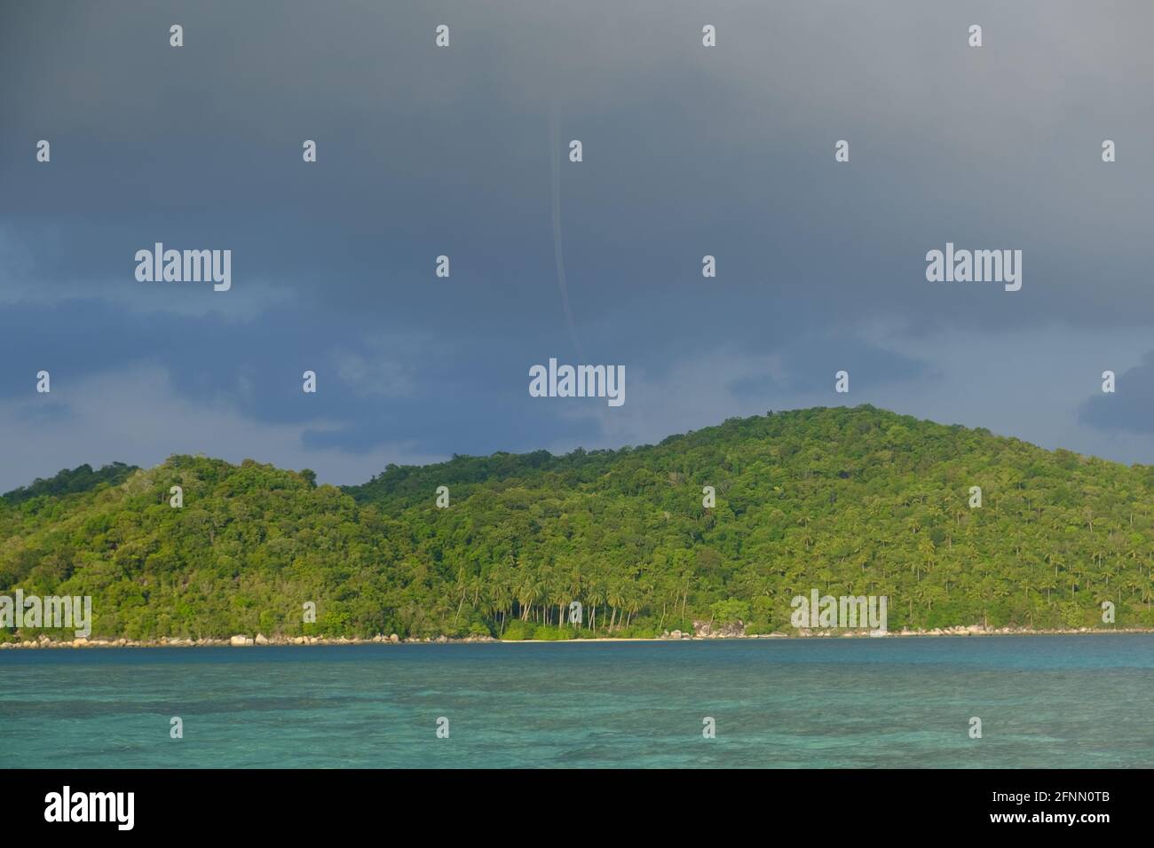Indonesia Anambas Islands - Telaga Island coastline and waterspout Stock Photo