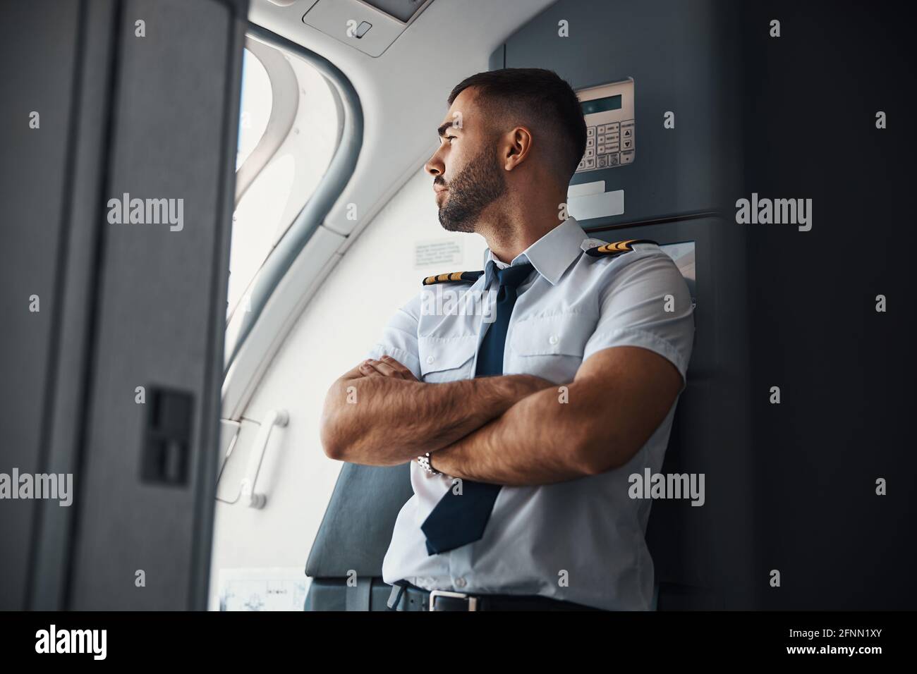 Curious pilot checking the weather before the flight Stock Photo