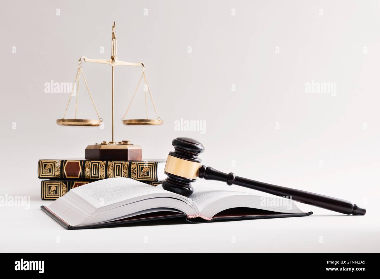 Law concept with wooden gavel and weight scale. Lawyer, attorney