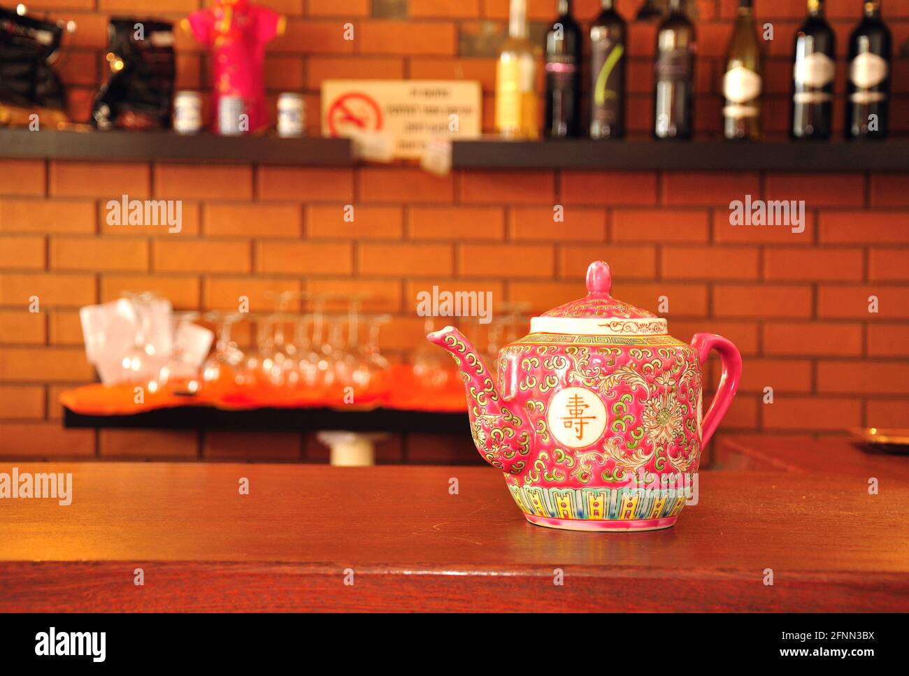 Chinese traditional teapot on the wooden counter in chinese restaurant