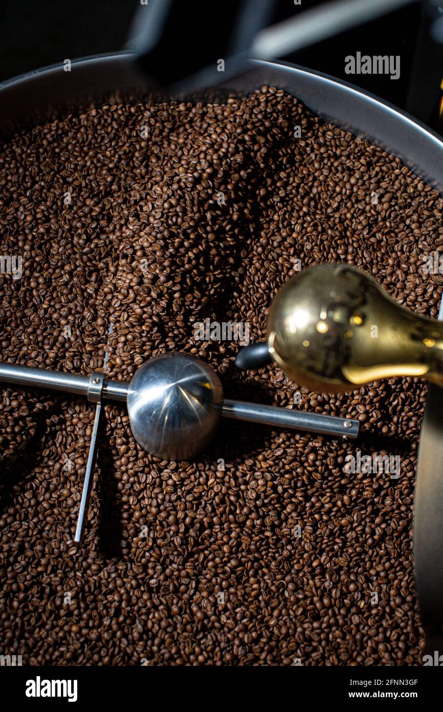 Overhead view of coffee beans in roaster Stock Photo