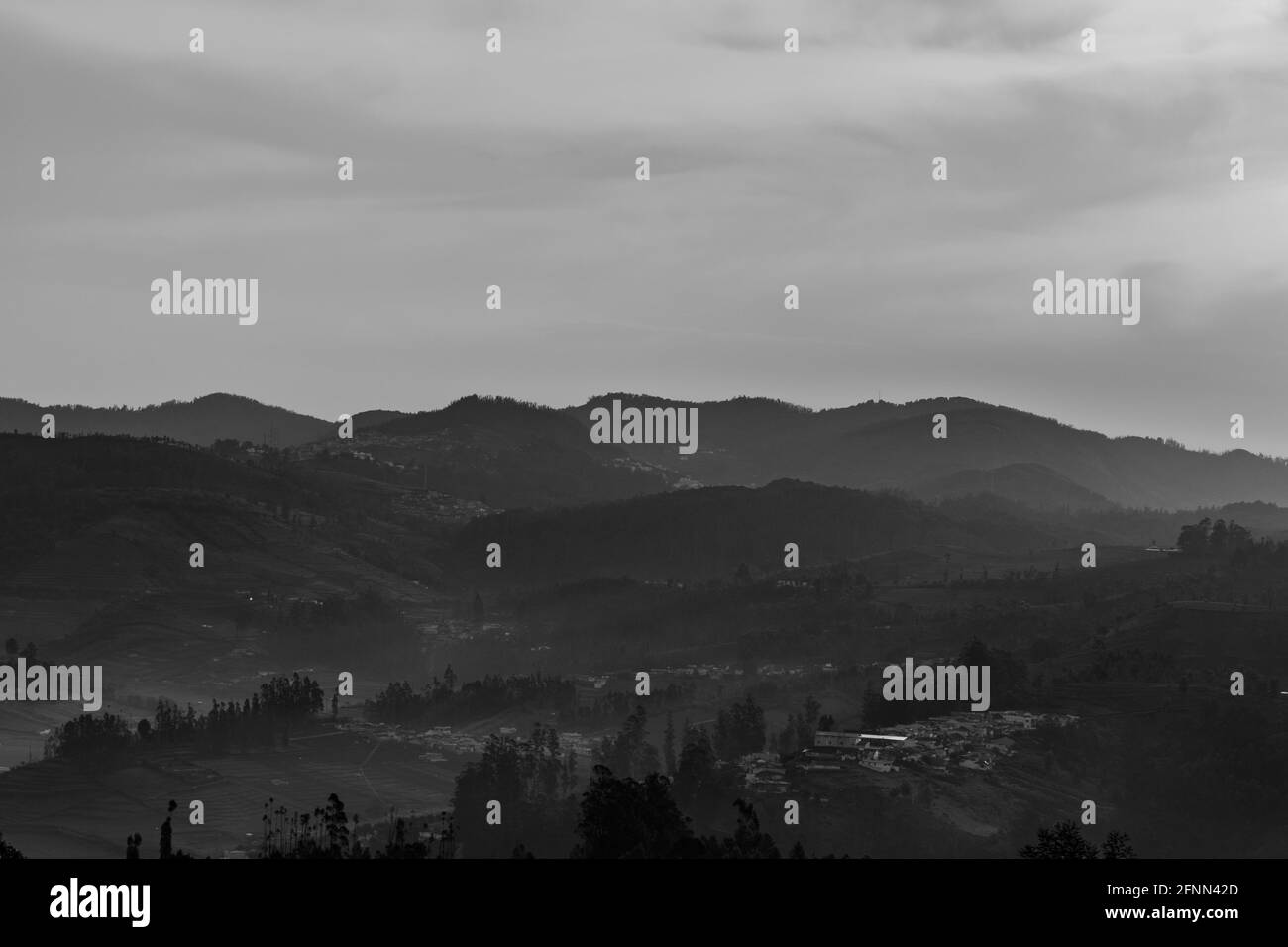 city view ooty from hill top in early morning or dawn image taken at dawn form top angle. The image is showing the city nestled in the foothills of mo Stock Photo