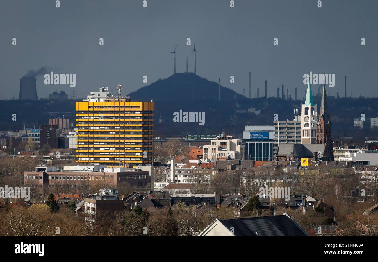 Gelsenkirchen, North Rhine-Westphalia, Germany - City overview Gelsenkirchen  with old town church in front of dark sky, in the back slag heap Oberscho  Stock Photo - Alamy