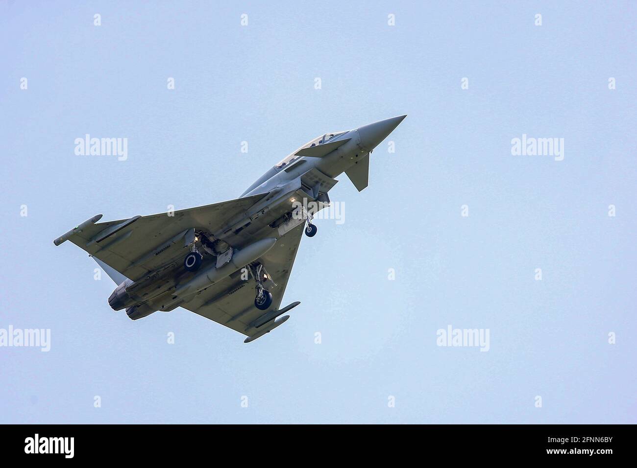 RAF Coningsby, Lincolnshire, UK. 18th May, 2021. An RAF Typhoon Eurofighter takes off from RAF Coningsby, Lincolnshire, on touch-and-go exercises. Credit: Peter Lopeman/Alamy Live News Stock Photo