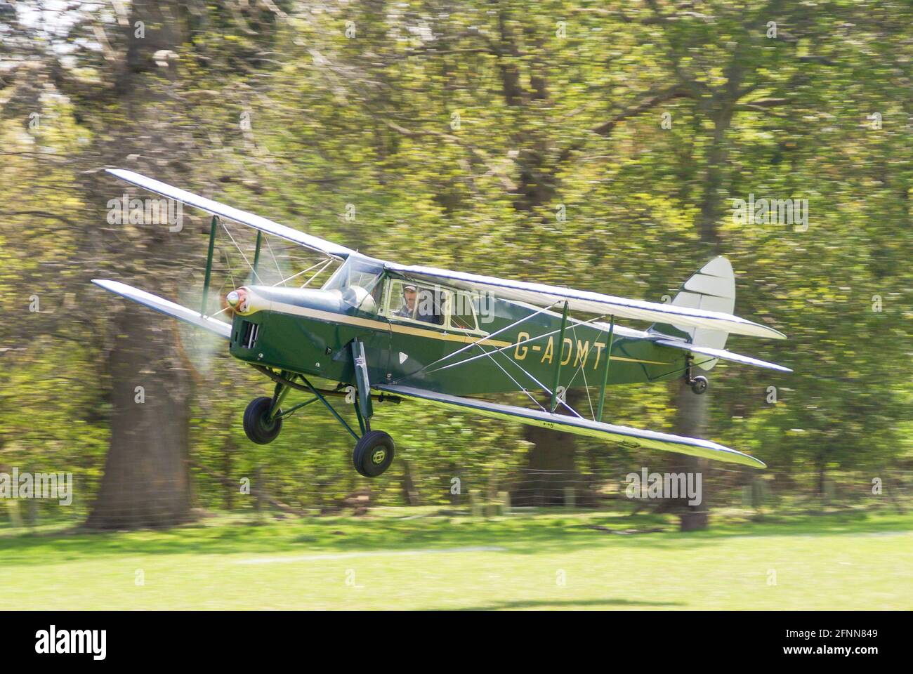 de Havilland DH87B Hornet Moth plane G-ADMT taking off from Henham Park ...