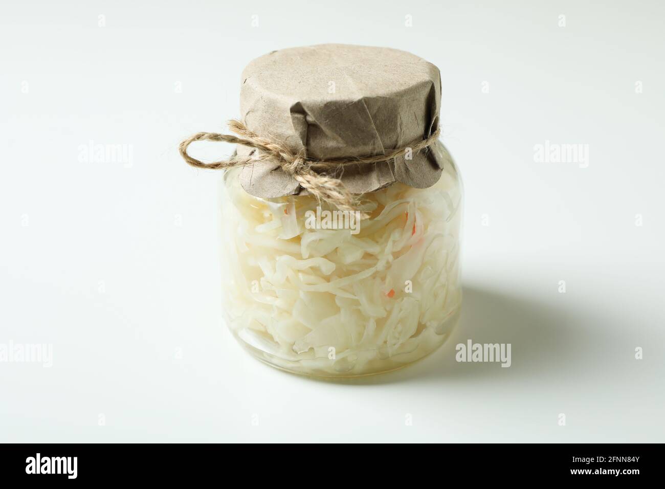Glass jar of sauerkraut on white background Stock Photo Alamy