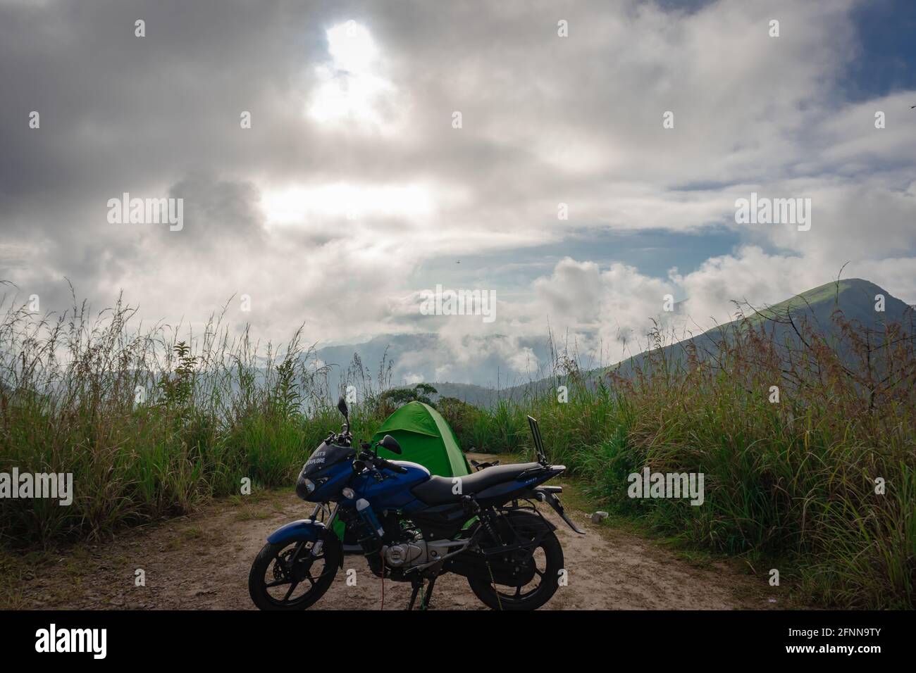 camping site at forests with motorcycle at tent Stock Photo