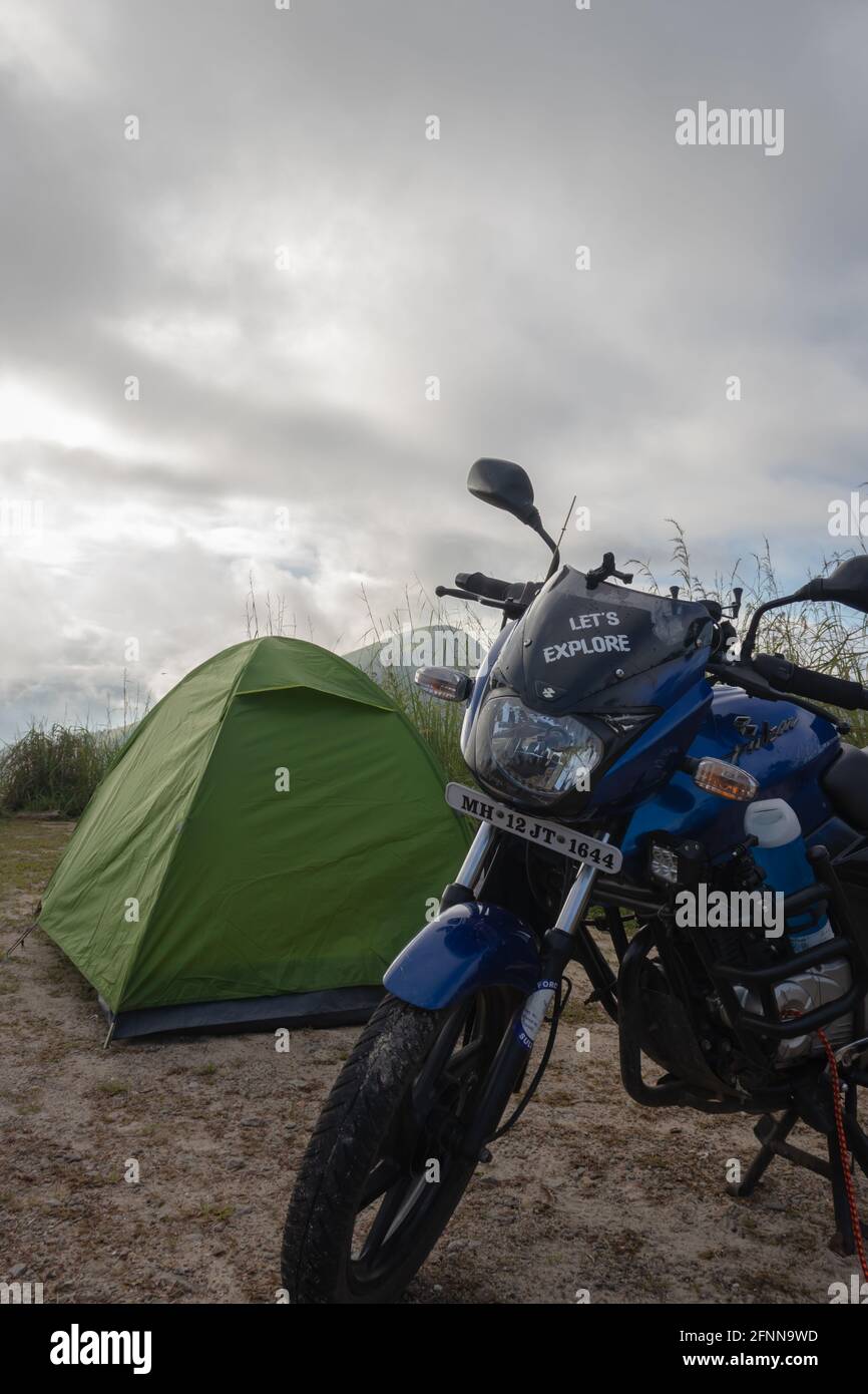 camping site at forests with motorcycle at tent Stock Photo
