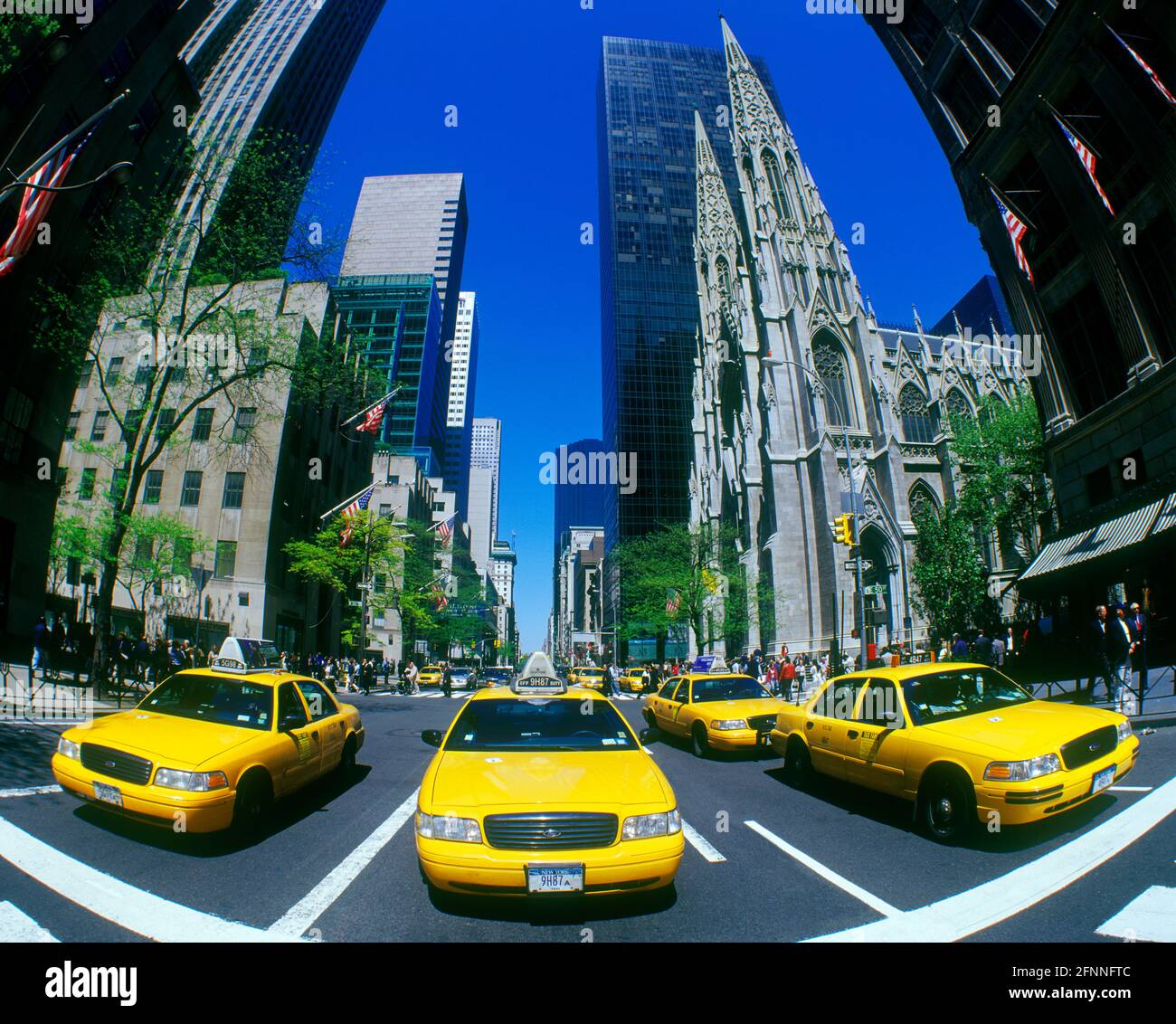 2004 HISTORICAL YELLOW TAXI CABS (©FORD MOTOR CO 2000) FIFTH AVENUE MIDTOWN MANHATTAN NEW YORK CITY USA Stock Photo