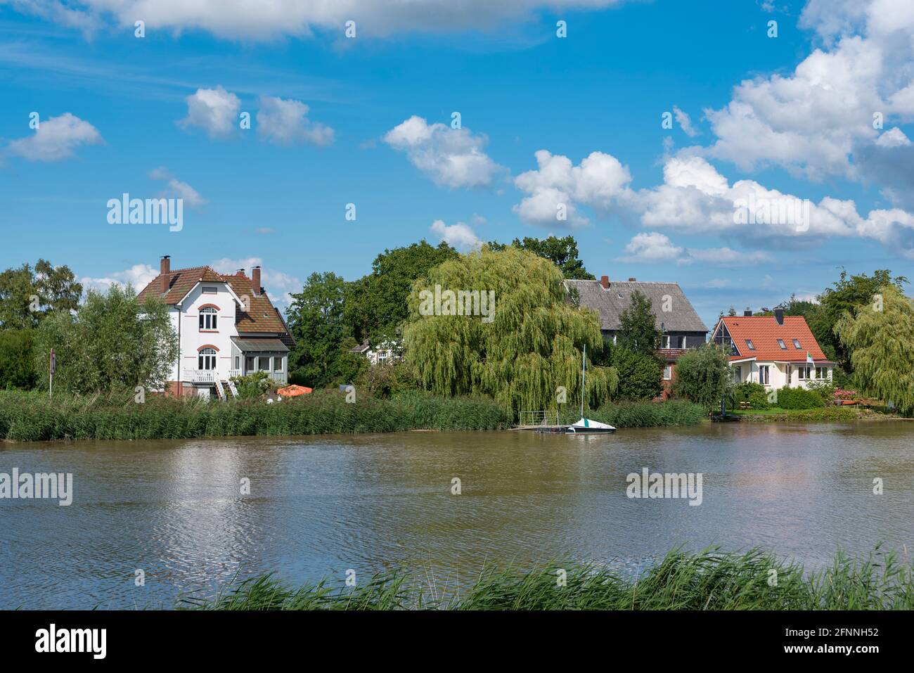 Landscape and houses on the river Oste, Osten, Lower Saxony, Germany, Europe Stock Photo