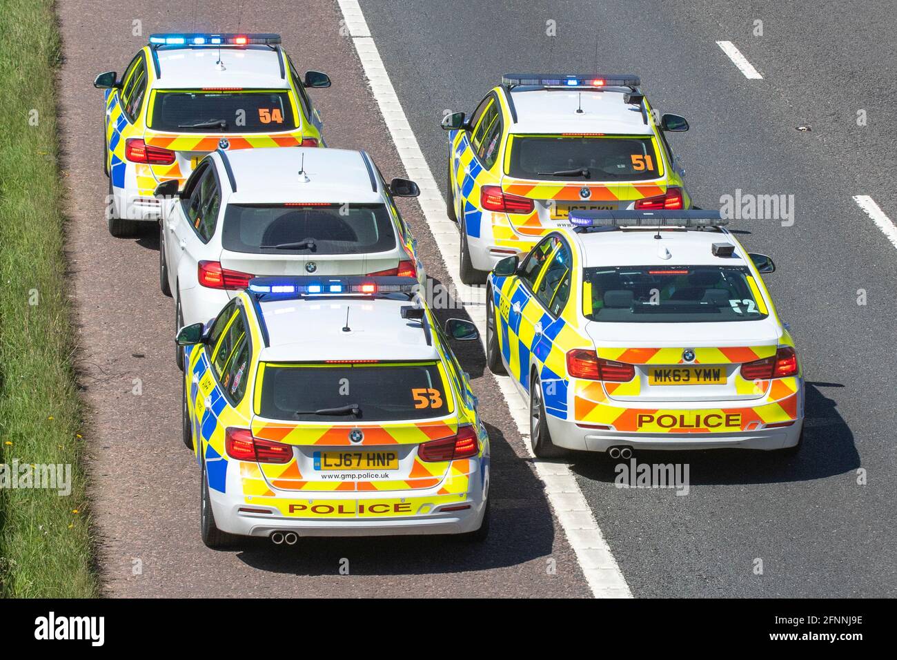 Police chase in Manchester, UK. April, 2022. TpacSafe stop tactics Tactical pursuit and containment (TPAC) stops. High-speed pursuit with pursued car disabled with the use of deployed Stinger. The PROSpike police stinger is a new and innovative vehicle-stop system. Stock Photo