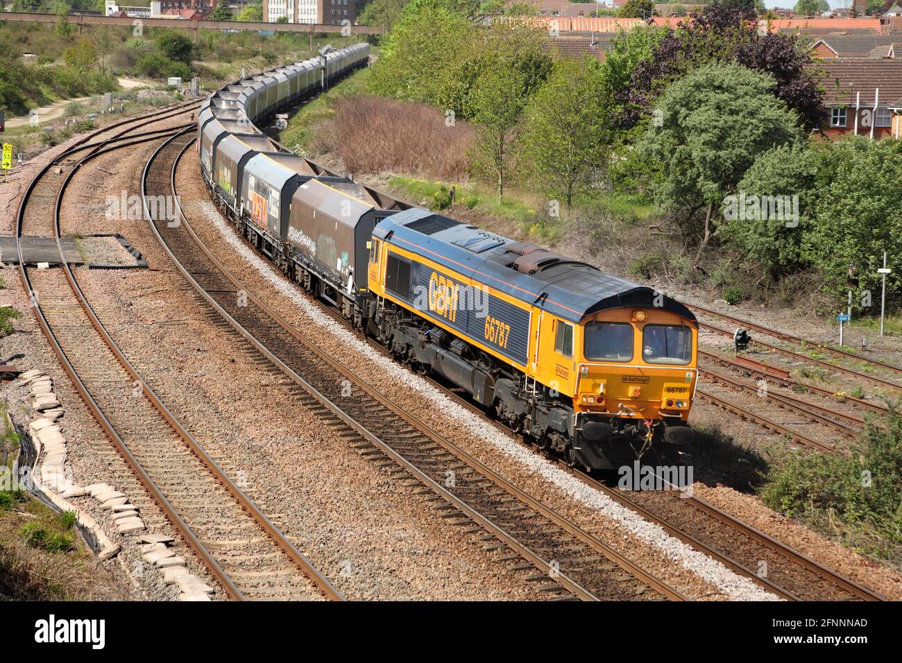 GB Railfreight Class 66 loco 66787 hauling the 0851 Hunslet Tilcon to Scunthorpe service through Scunthorpe on 18/5/21. Stock Photo