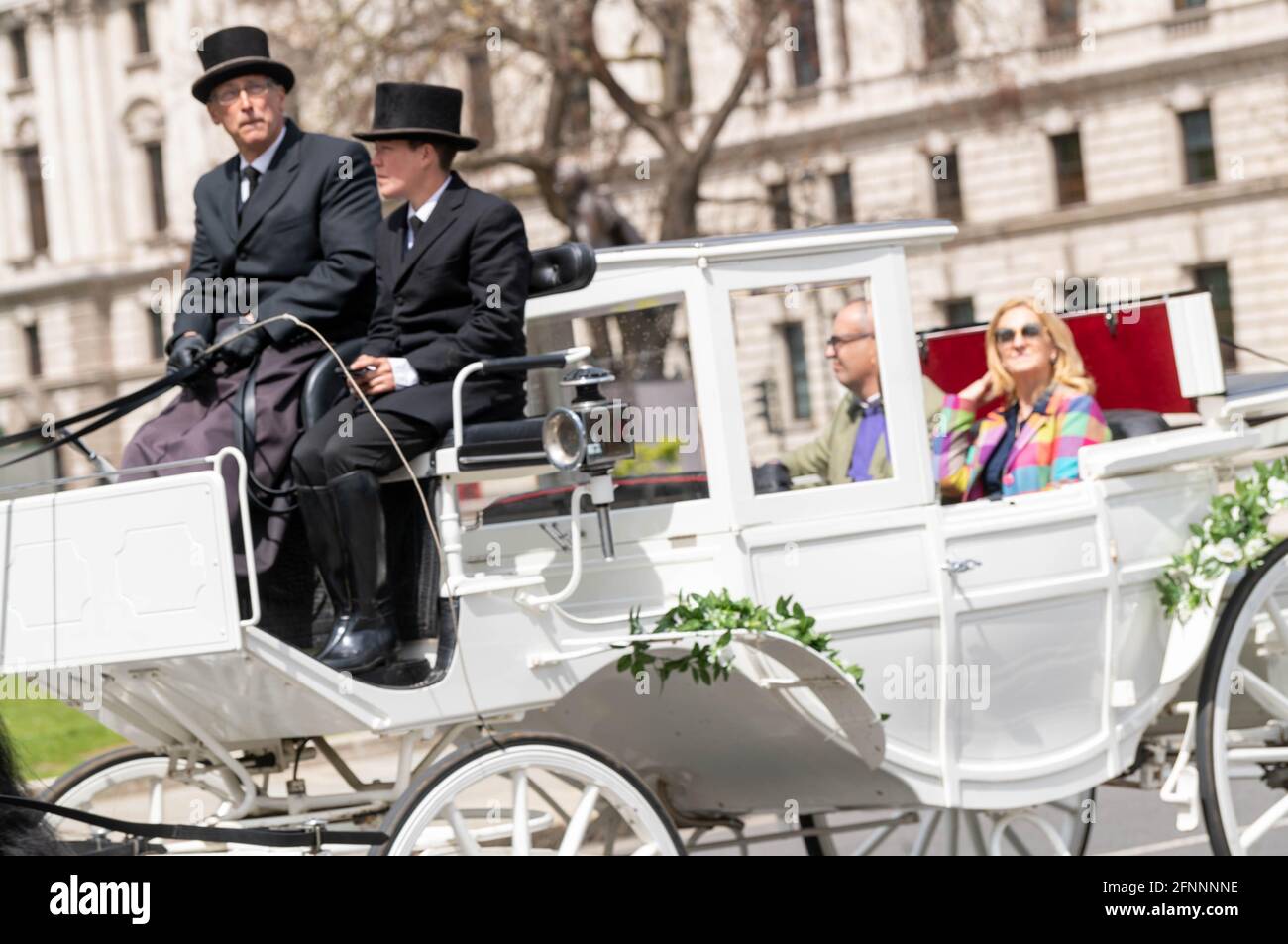 London, UK. 18th May, 2021. Visitors return to London, A horse and carriage outside the Houses of Parliament Credit: Ian Davidson/Alamy Live News Stock Photo