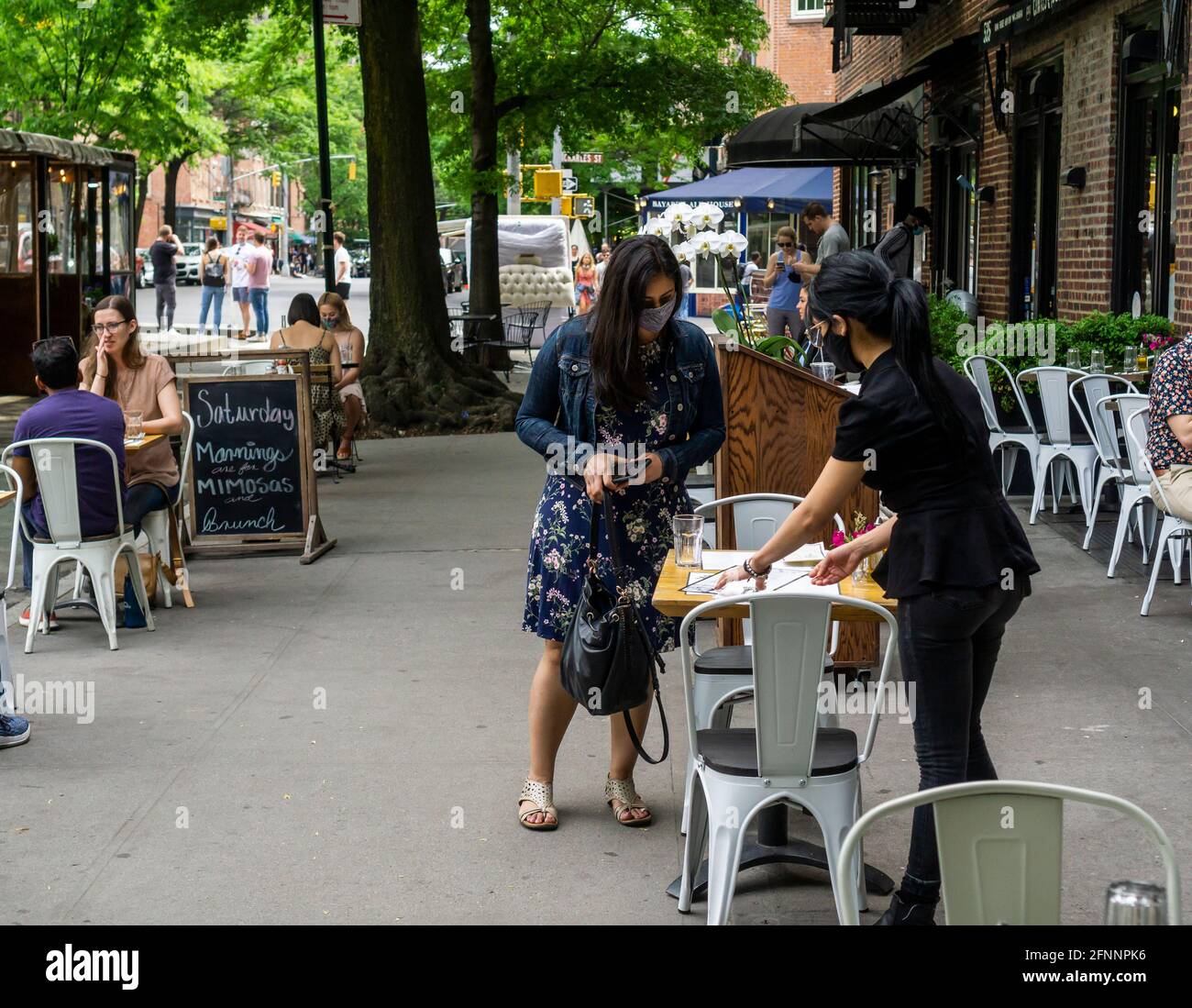 Al fresco dining at a sidewalk cafe in the New York neighborhood of the