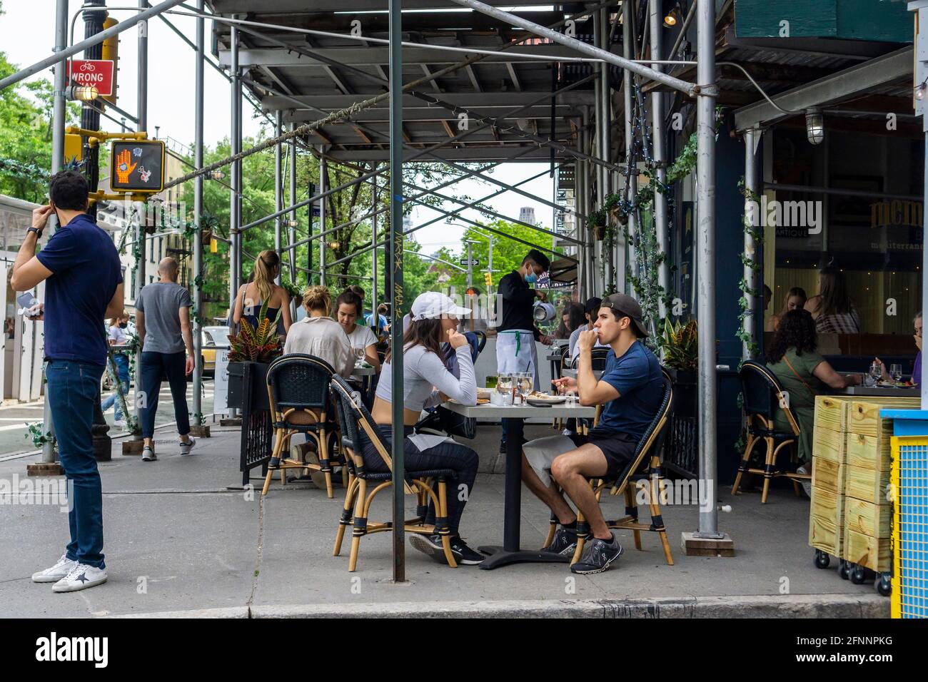 Al fresco dining at a sidewalk cafe in the New York neighborhood of the